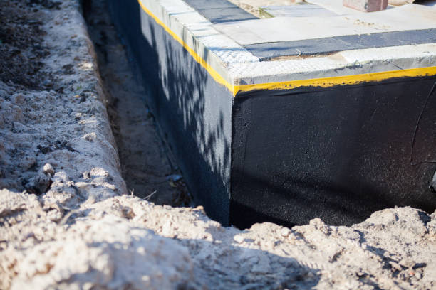Professional Basement Waterproofing technician working in Oceanside, NY